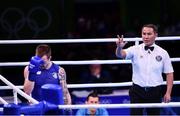 13 August 2016; Referee Rakhymzhan Rysbayev of Kazakhstan with Steven Donnelly of Ireland during his Welterweight preliminary round of 32 bout defeat to Mohammed Rabii of Morocco in the Riocentro Pavillion 6 Arena during the 2016 Rio Summer Olympic Games in Rio de Janeiro, Brazil. Photo by Stephen McCarthy/Sportsfile