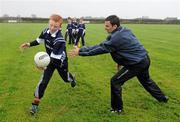 29 October 2010; Ulster bank GAA star Danny Hughes, Down, right, pictured with players, from the Ardglass GAA Under 10s and Under 12s, who won a coaching session courtesy of Ulster Bank. Ulster Bank GAA Coaching Session, Ardglass GAC, Ardglass, Co. Down. Picture credit: Oliver McVeigh / SPORTSFILE