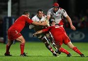 29 October 2010; Pedrie Wannenburg, Ulster, is tackled by Munster front row men Wian du Preez and Damian Varley. Celtic League, Ulster v Munster, Ravenhill Park, Belfast. Picture credit: John Dickson / SPORTSFILE
