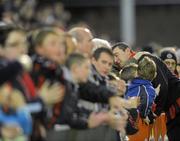 29 October 2010; A dejected Jason Byrne, Bohemians, is embraced by a fan after the match. Airtricity League Premier Division, Bohemians v Dundalk, Dalymount Park, Dublin. Picture credit: Brian Lawless / SPORTSFILE