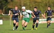 30 October 2010; Christopher Murray, Ireland, in action against Owen Fraser, left, and Stevie Stewart, Scotland. U21 Shinty - Hurling International Final, Ireland v Scotland, Ratoath GAA Club, Ratoath, Co. Meath. Picture credit: Barry Cregg / SPORTSFILE