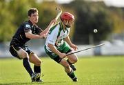 30 October 2010; Neil Heffernan, Ireland, in action against Daniel Grieve, Scotland. U21 Shinty - Hurling International Final, Ireland v Scotland, Ratoath GAA Club, Ratoath, Co. Meath. Picture credit: Barry Cregg / SPORTSFILE