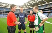 30 October 2010; Referee Tony Carroll tosses the coin between Scotland captain Gary Innes and Ireland captain Tommy Walsh before the game. Senior Hurling / Shinty International 1st Test, Ireland v Scotland, Croke Park, Dublin. Picture credit: Diarmuid Greene / SPORTSFILE