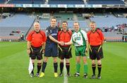 30 October 2010; Scotland captain Gary Innes and Ireland captain Tommy Walsh with referee Tony Carroll, centre and linesmen Ger Devlin, left, and Denis Richardson. Senior Hurling / Shinty International 1st Test, Ireland v Scotland, Croke Park, Dublin. Picture credit: Diarmuid Greene / SPORTSFILE