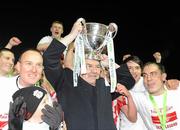 30 October 2010; John Hume celebrates with the Derry City players and the Airtricity League First Division trophy. Airtricity League First Division, Monaghan United v Derry City, Gortakeegan, Monaghan. Picture credit: Oliver McVeigh / SPORTSFILE