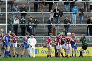 31 October 2010; Referee Michael Dolan breaks up a tussle between the players. Galway County Senior Hurling Championship Final, Clarinbridge v Loughrea, Pearse Stadium, Galway. Picture credit: Brian Lawless / SPORTSFILE