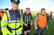 31 October 2010; Referee Michael Dolan makes his way off the pitch after the match ended in a draw. Galway County Senior Hurling Championship Final, Clarinbridge v Loughrea, Pearse Stadium, Galway. Picture credit: Brian Lawless / SPORTSFILE