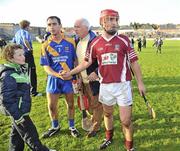 31 October 2010; Alan Kerins, Clarinbridge, shakes hands with Loughrea captain Brian Mahony after the match ended in a draw. Galway County Senior Hurling Championship Final, Clarinbridge v Loughrea, Pearse Stadium, Galway. Picture credit: Brian Lawless / SPORTSFILE