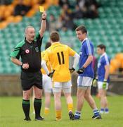 31 October 2010; Referee Martin Sludden shows yellow cards to Rodney Gorman, Clontibret, and Johnny McLoone, Naomh Conaill, after a first half incident. AIB GAA Football Ulster Club Senior Championship Quarter-Final, Clontibret v Naomh Conaill, Ballybofey, Co. Donegal. Picture credit: Oliver McVeigh / SPORTSFILE