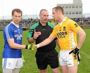 31 October 2010; Naomh Conaill Captain Anthony Thompson and Clontibret Captain Vincent Corey shake hands in the company of referee Martin Sludden before the game. AIB GAA Football Ulster Club Senior Championship Quarter-Final, Clontibret v Naomh Conaill, Ballybofey, Co. Donegal. Picture credit: Oliver McVeigh / SPORTSFILE