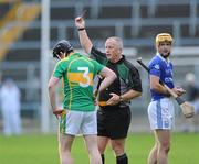 31 October 2010; James Heffernan, Clonoulty / Rossmore, is shown the red card by referee Keith Delahunty. Tipperary County Senior Hurling Championship Final, Thurles Sarsfields v Clonoulty / Rossmore, Semple Stadium, Thurles, Co. Tipperary. Picture credit: Matt Browne / SPORTSFILE