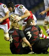 22 October 2010; Stephen Ferris, Ulster, is tackled by Scott MacLeod and Geoff Cross, right, Edinburgh. Celtic League, Edinburgh v Ulster, Murrayfield, Edinburgh, Scotland. Picture credit: Craig Watson / SPORTSFILE