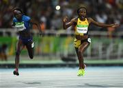 13 August 2016; Elaine Thompson of Jamaica celebrates winning the Women's 100m Final ahead of second place finisher Tori Bowie of USA in the Olympic Stadium, Maracanã, during the 2016 Rio Summer Olympic Games in Rio de Janeiro, Brazil. Photo by Brendan Moran/Sportsfile