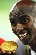 13 August 2016; Mo Farah of Great Britain with his gold medal for the Men's 10000m in the Olympic Stadium, Maracanã, during the 2016 Rio Summer Olympic Games in Rio de Janeiro, Brazil. Photo by Brendan Moran/Sportsfile