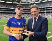 14 August 2016; Cian Darcy of Tipperary is presented with the Electric Ireland Man of the Match by Jim Dollard, Executive Director for Business Service Centre and Electric Ireland after the All-Ireland Minor Championship Semi-Finalthe Electric Ireland GAA Hurling All-Ireland Minor Championship Semi-Final game between Galway and Tipperary at Croke Park, Dublin. Photo by Ray McManus/Sportsfile