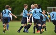 14 August 2016; Connor Moore of Belvedere is congratulated by team-mates after scoring his side's first and winning goal during the final of the Volkswagen Junior Masters Under 13 Football Tournament at the AUL Sports Grounds, Dublin Airport, Dublin. Photo by Sportsfile