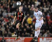 29 October 2010; Liam Burns, Dundalk, heads the ball away from Paddy Madden, Bohemians. Airtricity League Premier Division, Bohemians v Dundalk, Dalymount Park, Dublin. Picture credit: Barry Cregg / SPORTSFILE