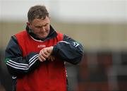 31 October 2010; O'Loughlin Gaels manager Michael Nolan checks his watch towards the end of the game. AIB GAA Hurling Leinster Club Senior Championship Quarter-Final, Rathdowney/Errill v O'Loughlin Gaels, O'Moore Park, Portlaoise, Co. Laois. Picture credit: Barry Cregg / SPORTSFILE