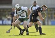 30 October 2010; Chistopher Murray, Ireland, in action against Drew Howie, Scotland. U21 Shinty - Hurling International Final, Ireland v Scotland, Ratoath GAA Club, Ratoath, Co. Meath. Picture credit: Barry Cregg / SPORTSFILE