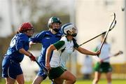 30 October 2010; Roisin O'Keeffe, Ireland, in action against Aisling Gribbin and Yvonne Connaughton, Scotland. Ladies Shinty / Camogie International, Ireland v Scotland, Ratoath GAA Club, Ratoath, Co. Meath. Picture credit: Alan Place / SPORTSFILE
