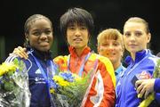 18 September 2010; Cancan Ren, China, second from left, after picking up her gold medal following the 51kg Flyweight Final, with silver medalist Nicola Adams, England, left, and bronze medalists Tetyana Kob, Ukraine, and Hanne Makinen, Finalnd, right. AIBA Women World Boxing Championships Barbados 2010 - Finals, Garfield Sobers Sports Gymnasium, Bridgetown, Barbados. Picture credit: Stephen McCarthy / SPORTSFILE