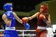 18 September 2010; Katie Taylor, Ireland, blue, exchanges punches with Cheng Dong, China, red, during their 60kg Lightweight Final. AIBA Women World Boxing Championships Barbados 2010 - Finals, Garfield Sobers Sports Gymnasium, Bridgetown, Barbados. Picture credit: Stephen McCarthy / SPORTSFILE