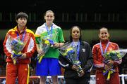 18 September 2010; Katie Taylor, Ireland, after receiving her gold medal after her victory over Cheng Dong, China, silver medalist, left, during their 60kg Lightweight Final, also on the podium are bronze medalists Queen Underwood, USA, and Karolina Graczyk, Poland, right. AIBA Women World Boxing Championships Barbados 2010 - Finals, Garfield Sobers Sports Gymnasium, Bridgetown, Barbados. Picture credit: Stephen McCarthy / SPORTSFILE