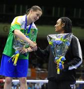 18 September 2010; Katie Taylor, Ireland, is congratulated on her gold medal following the 60kg Lightweight Final by bronze medalist Queen Underwood, USA, who she defeated in the semi-final. AIBA Women World Boxing Championships Barbados 2010 - Finals, Garfield Sobers Sports Gymnasium, Bridgetown, Barbados. Picture credit: Stephen McCarthy / SPORTSFILE