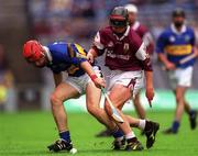 12 August 2001; Diarmuid Fitzgerald of Tipperary is tackled by Kevin Hayes of Galway during the All-Ireland Minor Hurling Championship Semi-Final between Galway and Tipperary at Croke Park in Dublin. Photo by Ray McManus/Sportsfile