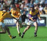 25 August 2001; Darren Stamp of Wexford in action against Martin Scullion and Trevor Kelly of Antrim during the All-Ireland U21 Hurling Championship Semi-Final match between Wexford and Antrim at Parnell Park in Dublin. Photo by Ray Lohan/Sportsfile