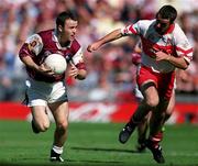 26 August 2001; Derek Savage of Galway in action against Sean Martin Lockhart of Derry during the Bank of Ireland All-Ireland Senior Football Championship Semi-Final match between Galway and Derry at Croke Park in Dublin. Photo by Brendan Moran/Sportsfile