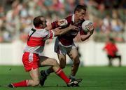 26 August 2001; Declan Meehan of Galway is tackled by Fergal Crossan of Derry during the Bank of Ireland All-Ireland Senior Football Championship Semi-Final match between Galway and Derry at Croke Park in Dublin. Photo by Brendan Moran/Sportsfile