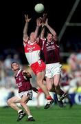 26 August 2001; Jarlath Fallon of Galway contests a dropping ball with Johnny McBride of Derry, watched by Galway's Declan Meehan, during the Bank of Ireland All-Ireland Senior Football Championship Semi-Final match between Galway and Derry at Croke Park in Dublin. Photo by Ray McManus/Sportsfile