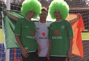 28 August 2001; The FAI today urged Irish fans to &quot;Go Green for Ireland&quot; in the run up to the Republic of Ireland's crucial FIFA World Cup Qualifier against Holland on Saturday next. Lending their support are, from left, Suzanne Johnston, Republic of Ireland's Robbie Keane and Marleen Kiely at John Hyland Park in Baldonnell, Dublin. Photo by Brendan Moran/Sportsfile