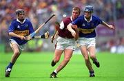 12 August 2001; Kevin Hayes of Galway in action against Tipperary's Pat Buckley, right, and Dara Walton during the All-Ireland Minor Hurling Championship Semi-Final between Galway and Tipperary at Croke Park in Dublin. Photo by Brian Lawless/Sportsfile