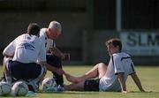 28 August 2001; Kevin Kilbane is attended to by physiotherapist Mick Byrne and chartered physiotherapist Ciaran Murray, left, during a Republic of Ireland training session at John Hyland Park in Baldonnell, Dublin. Photo by David Maher/Sportsfile