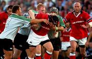 28 August 2001; Anthony Foley of Munster is tackled by Connacht players, from left, Marnus Uijs, 2, Des Dillon and Rowan Frost during the Celtic League match between Munster and Connacht at at Thomond Park in Limerick. Photo by Matt Browne/Sportsfile