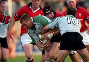 28 August 2001; Gavin Duffy with the support of his Connacht team-mate Eric Elwood, 10, is tackled by Anthony Foley of Munster during the Celtic League match between Munster and Connacht at at Thomond Park in Limerick. Photo by Matt Browne/Sportsfile