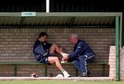 30 August 2001; Ian Harte sits out training while Republic of Ireland physiotherapist Mick Byrne straps his ankle with an ice pack during a Republic of Ireland training session at John Hyland Park in Baldonnell, Dublin. Photo by Aoife Rice/Sportsfile