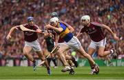 14 August 2016; Michael Cahill of Tipperary prepares to clear under pressure from Galway players John O'Dwyer, 25, Conor Cooney and Jason Flynn of Galway during the GAA Hurling All-Ireland Senior Championship Semi-Final game between Galway and Tipperary at Croke Park, Dublin. Photo by Ray McManus/Sportsfile