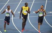 14 August 2016; Usain Bolt of Jamaica after winning the Men's 100m semi-final with second place Andre de Grasse of Canada, right, at the Olympic Stadium during the 2016 Rio Summer Olympic Games in Rio de Janeiro, Brazil. Photo by Ramsey Cardy/Sportsfile