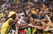 14 August 2016; Usain Bolt of Jamaica celebrates with fans after winning the Men's 100m final at the Olympic Stadium during the 2016 Rio Summer Olympic Games in Rio de Janeiro, Brazil. Photo by Stephen McCarthy/Sportsfile