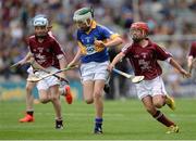 14 August 2016; Kevin Maher, Lisnakella, Oola, Co. Limerick, representing Tipperary, in action against Deaglán Ó hArragáin, Gaelscoil Na Cruaiche, Westport, Mayo, representing Galway, left, and Greg McEnaney, St Patrick's SNS, Skerries, Dublin, representing Galway, during the INTO Cumann na mBunscol GAA Respect Exhibition Go Games at the GAA Hurling All-Ireland Senior Championship Semi-Final game between Galway and Tipperary at Croke Park, Dublin. Photo by Piaras Ó Mídheach/Sportsfile