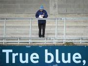 31 October 2010; A supporter reads the match program ahead of the game. Dublin County Senior Hurling Championship Final, Ballyboden St Enda's v St Vincent's, Parnell Park, Dublin. Picture credit: Stephen McCarthy / SPORTSFILE