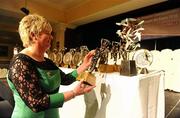 6 November 2010; President of the Camogie Association Joan O' Flynn examines the awards ahead of the banquet. 2010 Camogie All-Stars in association with O’Neills, Citywest Hotel, Saggart, Co. Dublin. Picture credit: Stephen McCarthy / SPORTSFILE