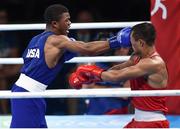 16 August 2016; Gary Russell of USA, left, exchanges punches with Fazliddin Gaibnazarov of Uzbekistan during their Light Welterweight Quarterfinal bout at the Riocentro Pavillion 6 Arena during the 2016 Rio Summer Olympic Games in Rio de Janeiro, Brazil. Photo by Stephen McCarthy/Sportsfile