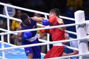 16 August 2016; Gary Russell of USA, left, exchanges punches with Fazliddin Gaibnazarov of Uzbekistan during their Light Welterweight Quarterfinal bout at the Riocentro Pavillion 6 Arena during the 2016 Rio Summer Olympic Games in Rio de Janeiro, Brazil. Photo by Stephen McCarthy/Sportsfile