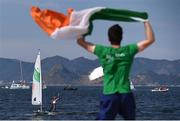 16 August 2016; Annalise Murphy of Ireland is congratulated by sailing team-mate Finn Lynch after winning a silver medal after the Women's Laser Radial Medal race on the Pão de Açúcar course, Copacabana, during the 2016 Rio Summer Olympic Games in Rio de Janeiro, Brazil. Photo by Brendan Moran/Sportsfile