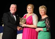 6 November 2010; Caroline Connaughton, Roscommon, is presented with her 2010 Camogie Soaring Star award by Cormac Farrell, Marketing Director, O'Neills, and President of the Camogie Association Joan O' Flynn at the 2010 Camogie All-Stars in association with O’Neills. Citywest Hotel, Saggart, Co. Dublin. Picture credit: Stephen McCarthy / SPORTSFILE