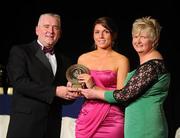 6 November 2010; Rhona Torney, Antrim, is presented with her 2010 Camogie Soaring Star award by Cormac Farrell, Marketing Director, O'Neills, and President of the Camogie Association Joan O' Flynn at the 2010 Camogie All-Stars in association with O’Neills. Citywest Hotel, Saggart, Co. Dublin. Picture credit: Stephen McCarthy / SPORTSFILE